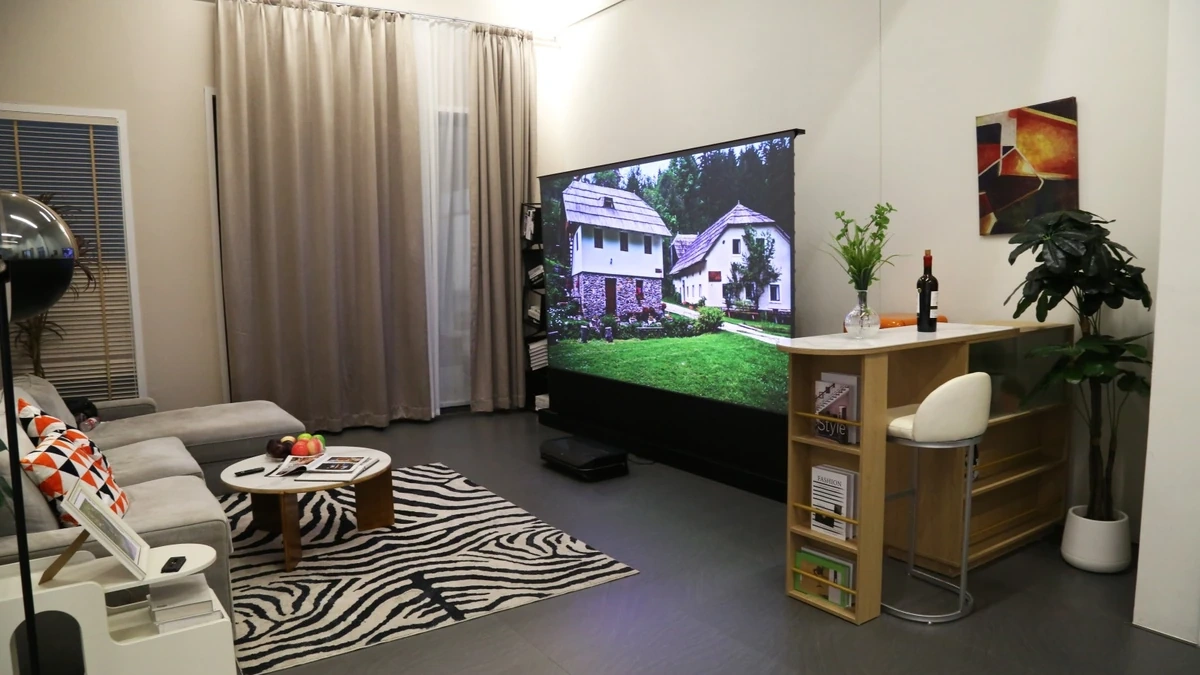 Living room converted into a home cinema with projector and screen.