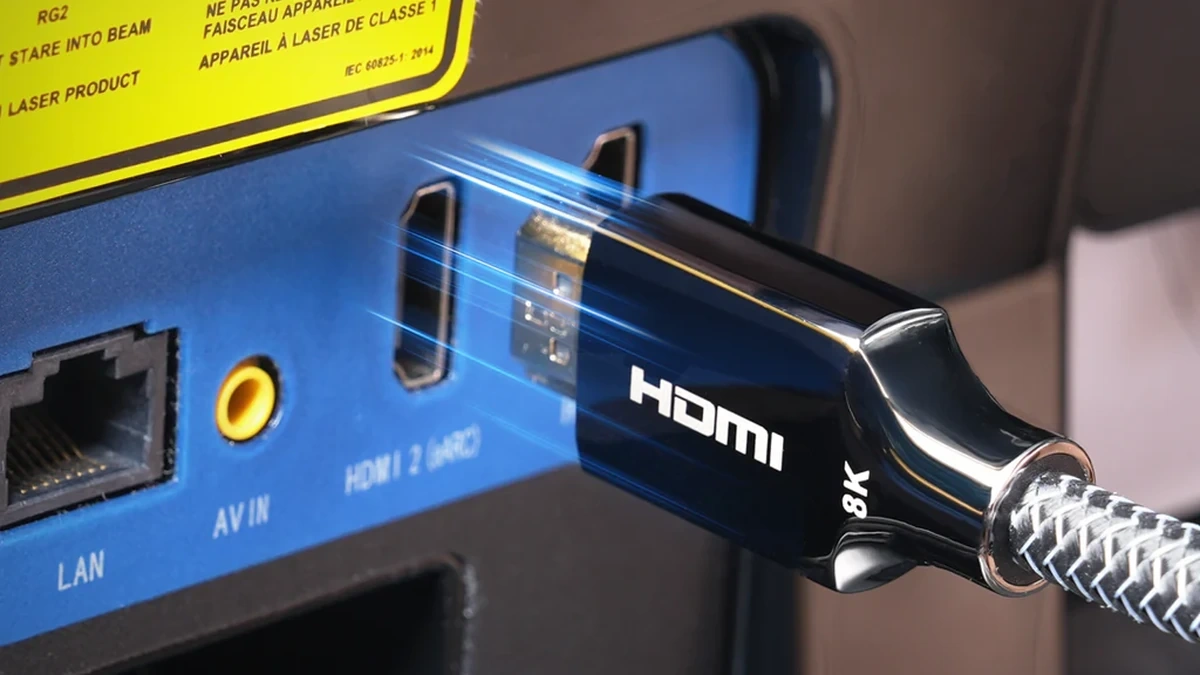 HDMI cable connected to the HDMI input on a projector.